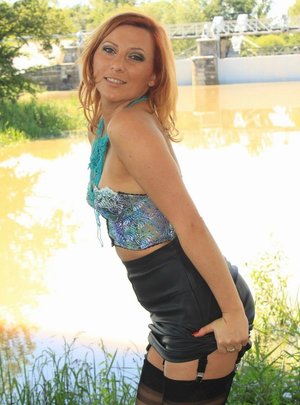 Amateur redhead solo girl Nicole Peters flaunting huge hooters in stockings